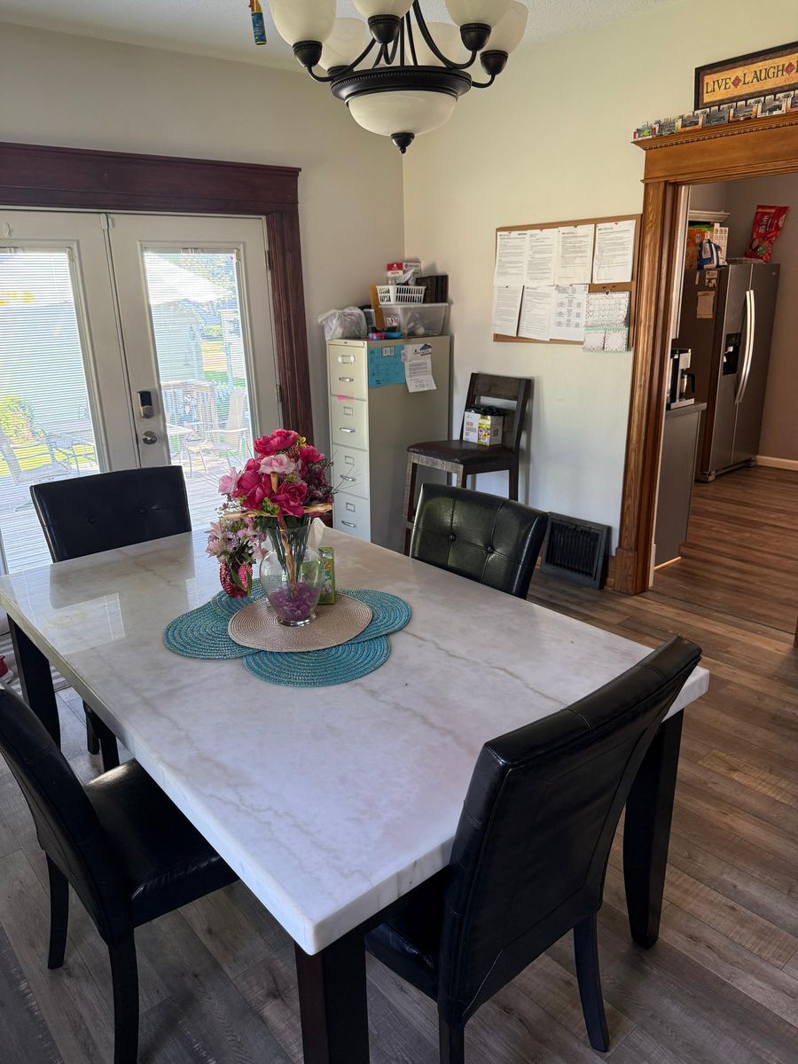 Dining room with marble table and french doors