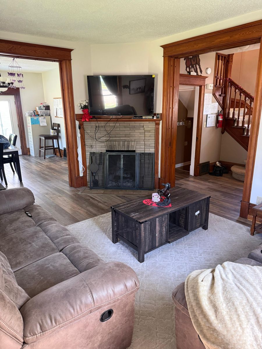 Living room with sectionals and original fireplace